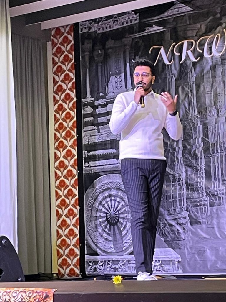 FinXpat Founder Aman Kapoor talking at an event