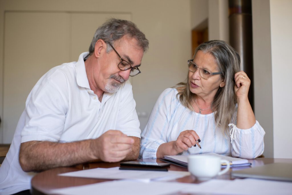 Expat elderly couple calculating their retirement plans in Germany